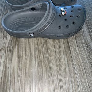 Gray worn crocs!